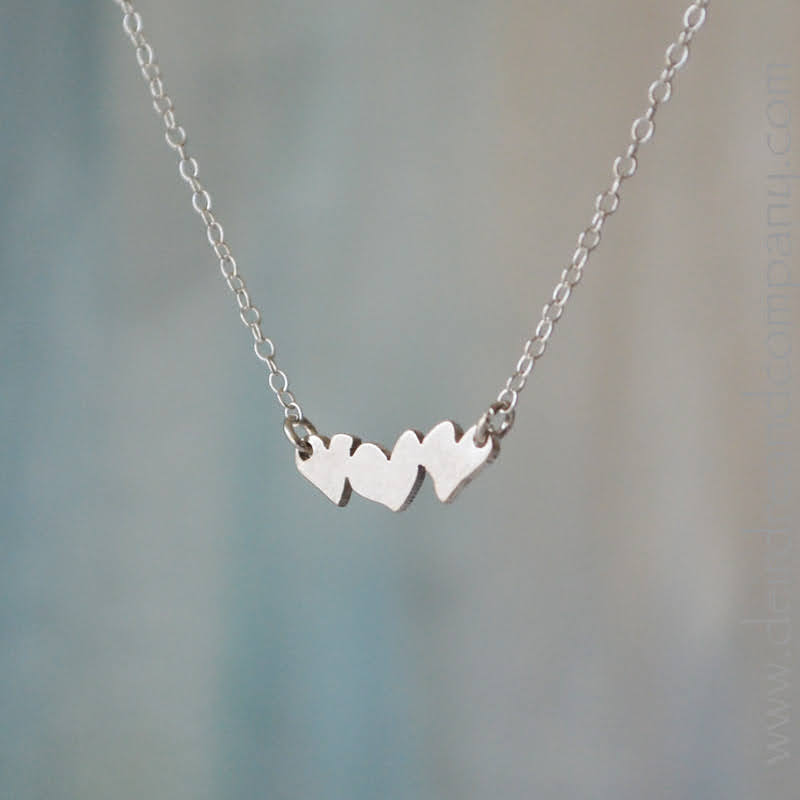 Tumble of Hearts Necklace in Sterling Silver & Gold