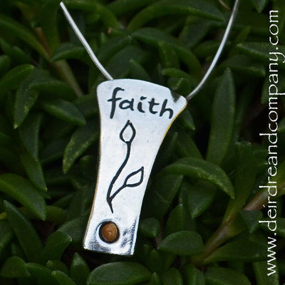 faith-silver-necklace-engraved-with-seedling-and-holds-a-mustard-seed