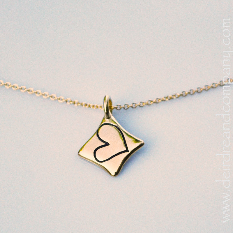 love-necklace-with-a-heart-inscribed-in-a-diamond-shaped-pendant-in-gold-vermeil