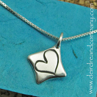 heart-inscribed-in-a-diamond-shaped-pendant-in-sterling-silver